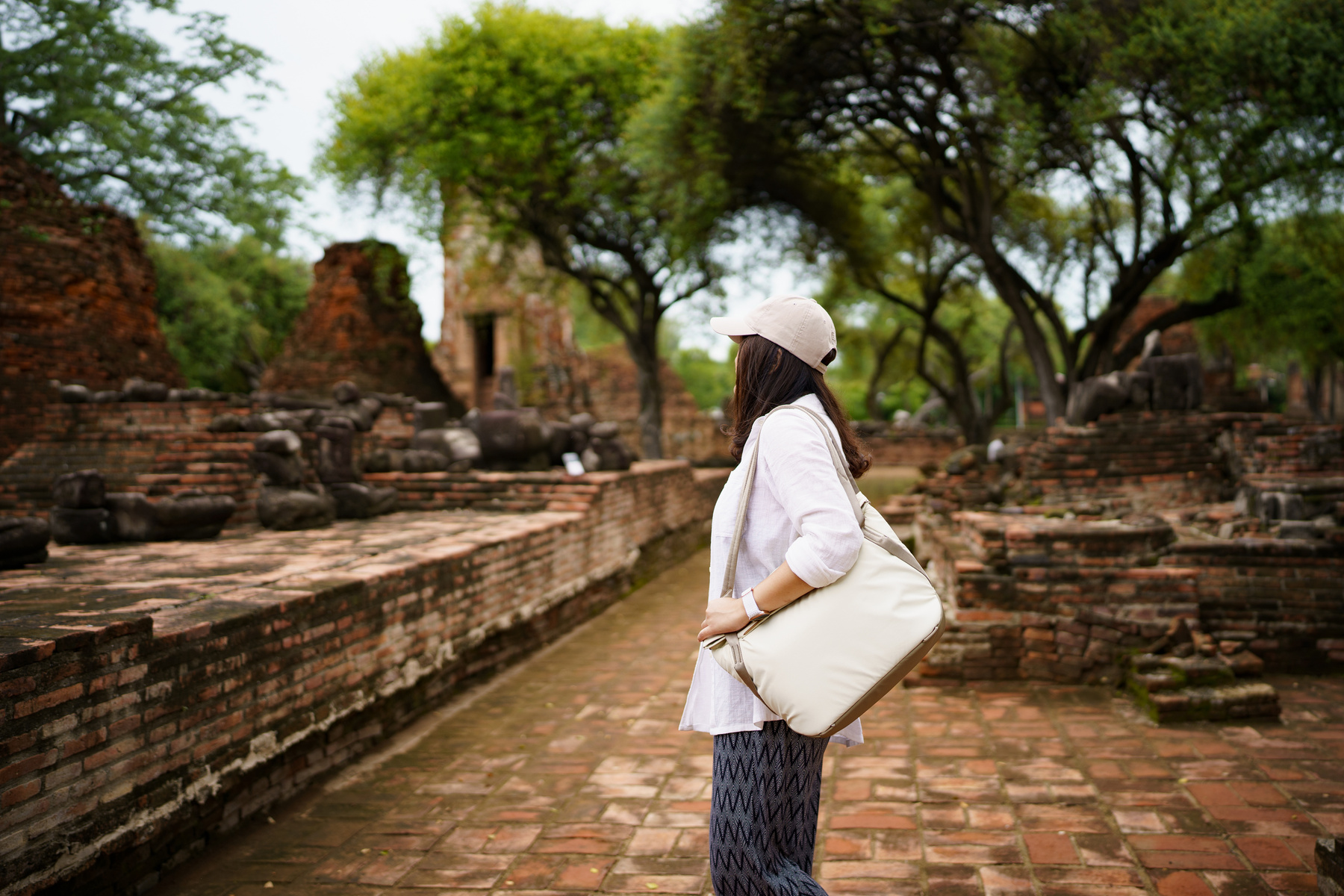 Summer Travel Archaeological Site in Asia. Asian Woman Traveler